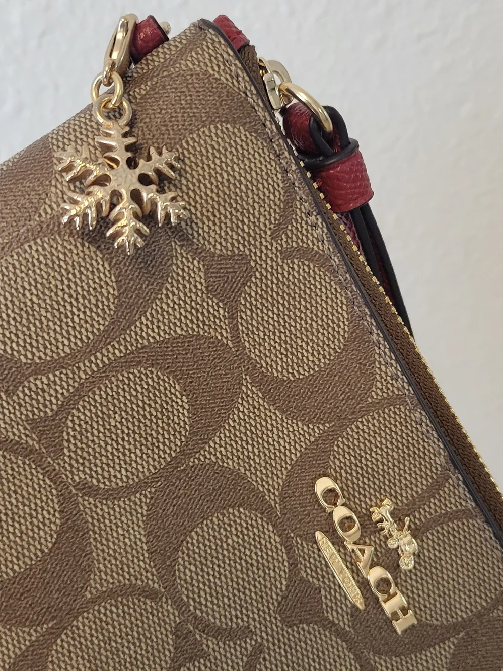 Coach Brown Signature Wristlet with Pink Strap